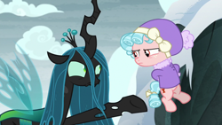 Size: 1920x1080 | Tagged: safe, screencap, cozy glow, queen chrysalis, changeling, changeling queen, pegasus, pony, frenemies (episode), clothes, cozy glow is not amused, duo, female, filly, foal, hat, raised hoof, winter outfit