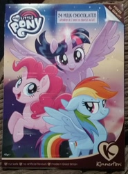 Size: 1836x2487 | Tagged: safe, derpibooru import, pinkie pie, rainbow dash, twilight sparkle, twilight sparkle (alicorn), alicorn, pony, my little pony: the movie, advent calendar, chocolate, christmas, food, great britain, holiday, irl, my little pony logo, photo, spread wings, wings