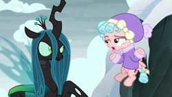 Size: 1280x720 | Tagged: safe, screencap, cozy glow, queen chrysalis, changeling, changeling queen, pegasus, pony, frenemies (episode), bickering, clothes, cozy glow is not amused, crown, female, filly, flapping, flying, foal, former queen chrysalis, freckles, glare, insect wings, jacket, jewelry, lidded eyes, raised eyebrow, raised hoof, regalia, shrug, snow, spread wings, wings, winter outfit