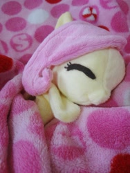 Size: 2346x3128 | Tagged: safe, artist:fallenpeach, fluttershy, pony, blanket, cute, eyes closed, irl, on side, photo, plushie, shyabetes, smiling, solo