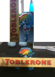 Size: 797x1110 | Tagged: safe, derpibooru import, rainbow dash, equestria girls, doll, equestria girls minis, eqventures of the minis, irl, photo, solo, toblerone, toy