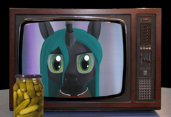 Size: 2560x1752 | Tagged: artist needed, source needed, safe, queen chrysalis, changeling, changeling queen, 3d, food, irl, looking at you, photo, pickle, solo, television