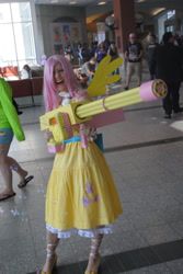 Size: 900x1344 | Tagged: safe, artist:fixinman, artist:siezure-in-a-bag, fluttershy, human, animethon, convention, cosplay, gun, irl, irl human, photo, weapon