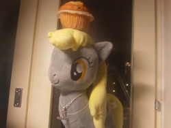 Size: 500x375 | Tagged: safe, artist:onlyfactory, derpy hooves, pegasus, pony, bootleg, female, irl, mare, muffin, necklace, photo, plushie, toy, waifu, window