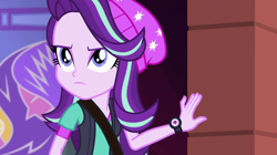 Size: 1280x718 | Tagged: safe, screencap, starlight glimmer, equestria girls, mirror magic, spoiler:eqg specials, beanie, clothes, determined, female, hat, shoulder bag, solo, vest, watch