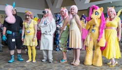 Size: 1280x732 | Tagged: artist needed, safe, artist:xenro8, fluttershy, human, bronycon, bunny ears, cosplay, dangerous mission outfit, element of kindness, fursuit, groucho mask, group photo, irl, irl human, optimus prime, photo, rule 63