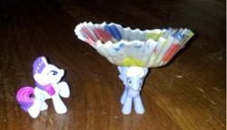 Size: 480x277 | Tagged: safe, artist:amythestquill, derpy hooves, rarity, pegasus, pony, derpy makes muffins, female, hat, i just don't know what went wrong, irl, mare, muffin, photo, silly derpy that's not a hat, toy