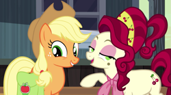 Size: 957x532 | Tagged: safe, screencap, applejack, cherry jubilee, earth pony, pony, the last roundup, cowboy hat, female, grin, hat, hooves, mare, open mouth, saddle bag, smiling