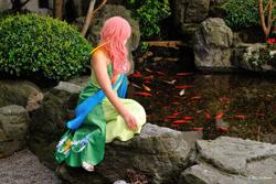 Size: 1024x682 | Tagged: safe, artist:areihanai, fluttershy, fish, human, animal, animation on display, clothes, cosplay, dress, gala dress, garden, irl, irl human, photo, solo, water