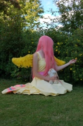 Size: 2000x3008 | Tagged: safe, artist:hebiriyu, fluttershy, human, cosplay, flower, grass, irl, irl human, photo, plushie, solo