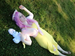 Size: 720x540 | Tagged: safe, artist:mintyblitzz, angel bunny, fluttershy, human, cosplay, female, flats, floral head wreath, grass, irl, irl human, on back, photo, plushie, sleeping, solo, winged humanization