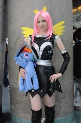 Size: 712x1072 | Tagged: safe, artist:onlyfactory, fluttershy, private pansy, human, anime expo, anime expo 2012, armor, armor skirt, bootleg, boots, clothes, cosplay, irl, irl human, photo, plushie, shoes, skirt, solo