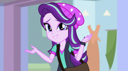 Size: 1280x718 | Tagged: safe, screencap, starlight glimmer, equestria girls, mirror magic, spoiler:eqg specials, awkward smile, beanie, cute, glimmerbetes, hat, shrug, solo