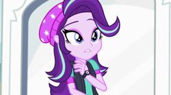 Size: 1280x718 | Tagged: safe, screencap, starlight glimmer, equestria girls, mirror magic, spoiler:eqg specials, beanie, hat, solo, watch