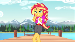 Size: 1100x618 | Tagged: safe, screencap, sunset shimmer, equestria girls, legend of everfree, camp everfree outfits, clothes, embrace the magic, female, lake, lidded eyes, mountain range, pier, rock, scenery, shorts, solo, tree