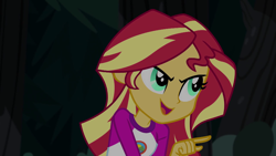 Size: 1280x720 | Tagged: safe, screencap, sunset shimmer, equestria girls, legend of everfree, camp everfree outfits, clothes, female, night, open mouth, pointing, smiling, smirk, solo, talking