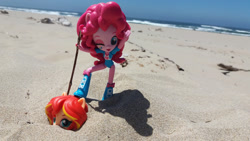 Size: 2064x1161 | Tagged: safe, artist:nightfly19, pinkie pie, sunset shimmer, equestria girls, abuse, beach, doll, equestria girls minis, eqventures of the minis, irl, ocean, photo, shimmerbuse, stick, toy