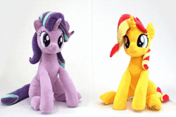 Size: 400x266 | Tagged: safe, artist:nekokevin, starlight glimmer, sunset shimmer, twilight sparkle, twilight sparkle (alicorn), alicorn, pony, unicorn, series:nekokevin's glimmy, 4de, animated, clothes, cute, female, gif, glimmerbetes, holding a pony, irl, looking down, mare, nekokevin is trying to murder us, photo, plushie, shimmerbetes, sitting, smiling, socks, starlight's little twibird, striped socks