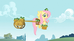 Size: 1054x591 | Tagged: safe, screencap, fluttershy, frog, pegasus, pony, feeling pinkie keen, cart, tactile telekinesis