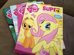 Size: 3264x2448 | Tagged: safe, applejack, fluttershy, earth pony, pegasus, pony, book, coloring book, merchandise