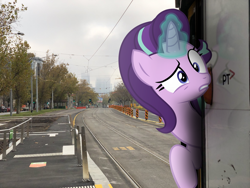 Size: 2048x1536 | Tagged: safe, artist:naijiwizard, starlight glimmer, pony, australia, dim, irl, looking at you, melbourne, photo, photoshop, ponies in real life, solo, suspicious, tram