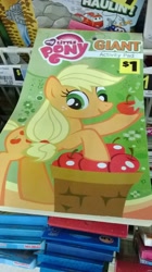 Size: 1456x2592 | Tagged: safe, applejack, earth pony, pony, blonde mane, book, female, mare, merchandise, orange coat, solo