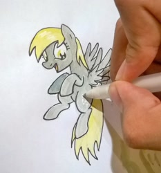 Size: 1728x1854 | Tagged: safe, artist:digiral, derpy hooves, pegasus, pony, drawn into existence, female, floating, fourth wall, hand, mare, solo, traditional art