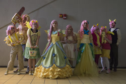 Size: 1000x667 | Tagged: artist needed, safe, artist:ethan hellstrom, artist:tokokono, butterscotch, fluttershy, human, .mov, chainsaw, clothes, convention, cosplay, dress, fluttercruel, fluttershed, gala dress, irl, irl human, ohayocon, ohayocon 2014, photo, plushie, rule 63, selfcest, suspenders