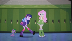 Size: 1445x819 | Tagged: safe, derpibooru import, screencap, fluttershy, spike, twilight sparkle, dog, equestria girls, equestria girls (movie), backpack, boots, clothes, high heel boots, lockers, out of context, skirt, socks, spike the dog