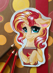 Size: 2812x3860 | Tagged: safe, artist:emberslament, artist:gaelledragons, sunset shimmer, pony, unicorn, collaboration, book, colored pencil drawing, craft, cute, female, floppy ears, looking at you, mare, photo, shimmerbetes, smiling, solo, traditional art, unshorn fetlocks