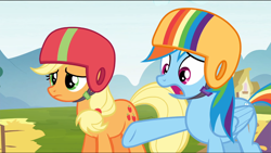 Size: 1360x768 | Tagged: safe, derpibooru import, screencap, applejack, rainbow dash, earth pony, pegasus, pony, the cart before the ponies, hay, hay bale, helmet