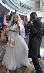 Size: 672x1120 | Tagged: safe, princess celestia, human, badass, cosplay, crossover, dual wield, gun, irl, irl human, long beach comic-con, nick fury, no trigger discipline, photo