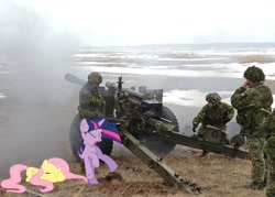 Size: 900x643 | Tagged: safe, artist:cplhenderson, derpibooru import, fluttershy, twilight sparkle, human, artillery, cadpat, canada, eyes closed, howitzer, irl, irl human, military, open mouth, photo, ponies in real life, prone, scared