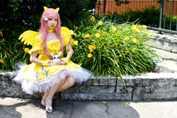Size: 900x600 | Tagged: artist needed, safe, angel bunny, fluttershy, human, 2012, animenext, choker, clothes, convention, cosplay, dress, high heels, irl, irl human, photo, sitting, solo