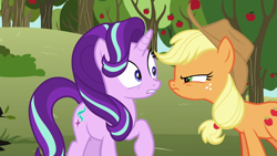 Size: 1280x720 | Tagged: safe, screencap, applejack, starlight glimmer, earth pony, pony, unicorn, no second prances, angry, apple, apple tree, applejack's hat, bags under eyes, cowboy hat, duo, female, food, freckles, glare, hat, looking at each other, mare, nervous, ponytail, raised hoof, squint, stetson, sweet apple acres, tree