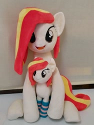 Size: 768x1024 | Tagged: safe, artist:nekokevin, oc, oc only, oc:poniko, earth pony, pony, clothes, duality, female, irl, looking at you, mare, open mouth, photo, plushie, sitting, size difference, smiling, socks, striped socks, underhoof