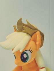 Size: 768x1024 | Tagged: safe, artist:nekokevin, applejack, earth pony, pony, applejack's hat, cowboy hat, female, freckles, hat, irl, mare, photo, plushie, simple background, smiling, solo, white background