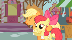 Size: 1366x768 | Tagged: safe, screencap, apple bloom, applejack, earth pony, pony, call of the cutie, apple sisters, apron, clothes, duo, eyes closed, female, filly, foal, hug, mare, raised hoof, sisters