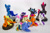 Size: 1280x853 | Tagged: safe, artist:dustysculptures, derpibooru import, apple bloom, applejack, nightmare moon, rainbow dash, rarity, scootaloo, sweetie belle, tempest shadow, twilight sparkle, alicorn, earth pony, pegasus, pony, unicorn, arm behind head, bipedal, book, bookhorse, bronycon, bronycon 2018, cape, clothes, craft, cutie mark crusaders, female, filly, hear no evil, irl, mare, on back, photo, prone, sculpture, see no evil, sitting, speak no evil, three wise monkeys, three wise ponies, trixie's cape