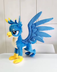 Size: 1440x1800 | Tagged: safe, artist:nekokevin, gallus, griffon, irl, lidded eyes, male, open mouth, photo, plushie, smiling, solo, spread wings, talons, teenager, wings