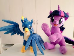 Size: 1024x768 | Tagged: safe, artist:nekokevin, gallus, twilight sparkle, unicorn twilight, griffon, pony, unicorn, duo, female, irl, looking at you, male, mare, open mouth, photo, plushie, raised hoof, sitting, smiling, spread wings, teenager, underhoof, wings