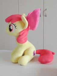 Size: 768x1024 | Tagged: safe, artist:nekokevin, apple bloom, earth pony, pony, bow, female, filly, hair bow, irl, photo, plushie, side view, sitting, smiling, solo