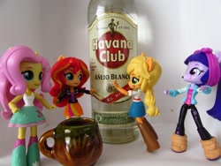 Size: 1320x990 | Tagged: safe, artist:whatthehell!?, fluttershy, sunset shimmer, twilight sparkle, equestria girls, alcohol, boots, clothes, cuba, denim skirt, doll, equestria girls minis, eqventures of the minis, irl, jacket, jar, pants, photo, rum, shoes, skirt, smiley face, spanish, spanish text, toy