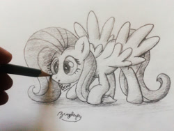 Size: 1260x945 | Tagged: safe, artist:bugplayer, fluttershy, pegasus, pony, :o, boop, bugplayer is trying to murder us, cute, drawn into existence, female, grayscale, hand, mare, monochrome, pencil, pencil drawing, shyabetes, solo, spread wings, traditional art