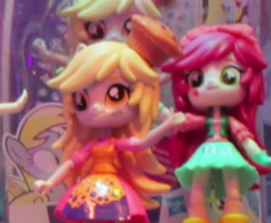 Size: 571x471 | Tagged: safe, derpy hooves, roseluck, equestria girls, clothes, doll, equestria girls minis, irl, photo, skirt, toy, toy fair, toy fair 2017