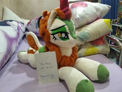 Size: 2048x1536 | Tagged: safe, artist:burgunzik, autumn blaze, kirin, sounds of silence, body pillow, female, irl, lidded eyes, photo, plushie, prone, smiling, solo focus