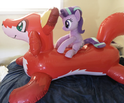 Size: 3651x3024 | Tagged: safe, starlight glimmer, fox, pony, unicorn, inflatable, inflatable toy, irl, photo, plushie, pool toy, riding, sitting