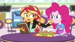 Size: 1280x720 | Tagged: safe, screencap, pinkie pie, sunset shimmer, equestria girls, mirror magic, spoiler:eqg specials, book, bracelet, burger, chair, discovery family logo, food, geode of empathy, geode of sugar bombs, hamburger, jewelry, journal, looking at each other, magical geodes, raised eyebrow, smiling, storefront, table, television, tray