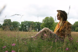 Size: 4272x2848 | Tagged: safe, artist:paranoiaagentothello, applejack, human, cosplay, flower, grass, irl, irl human, outdoors, photo, sitting, solo