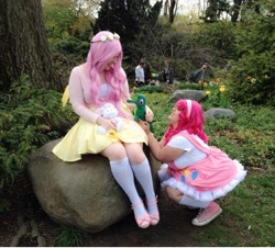 Size: 600x542 | Tagged: safe, artist:blossoming cosplay, artist:mintyblitzz, angel bunny, fluttershy, gummy, pinkie pie, human, cosplay, female, floral head wreath, flower, irl, irl human, kneesocks, photo